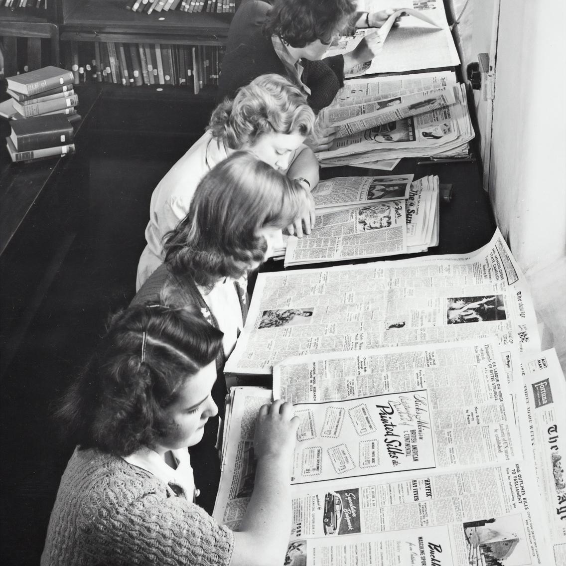 Vintage women reading newspapers